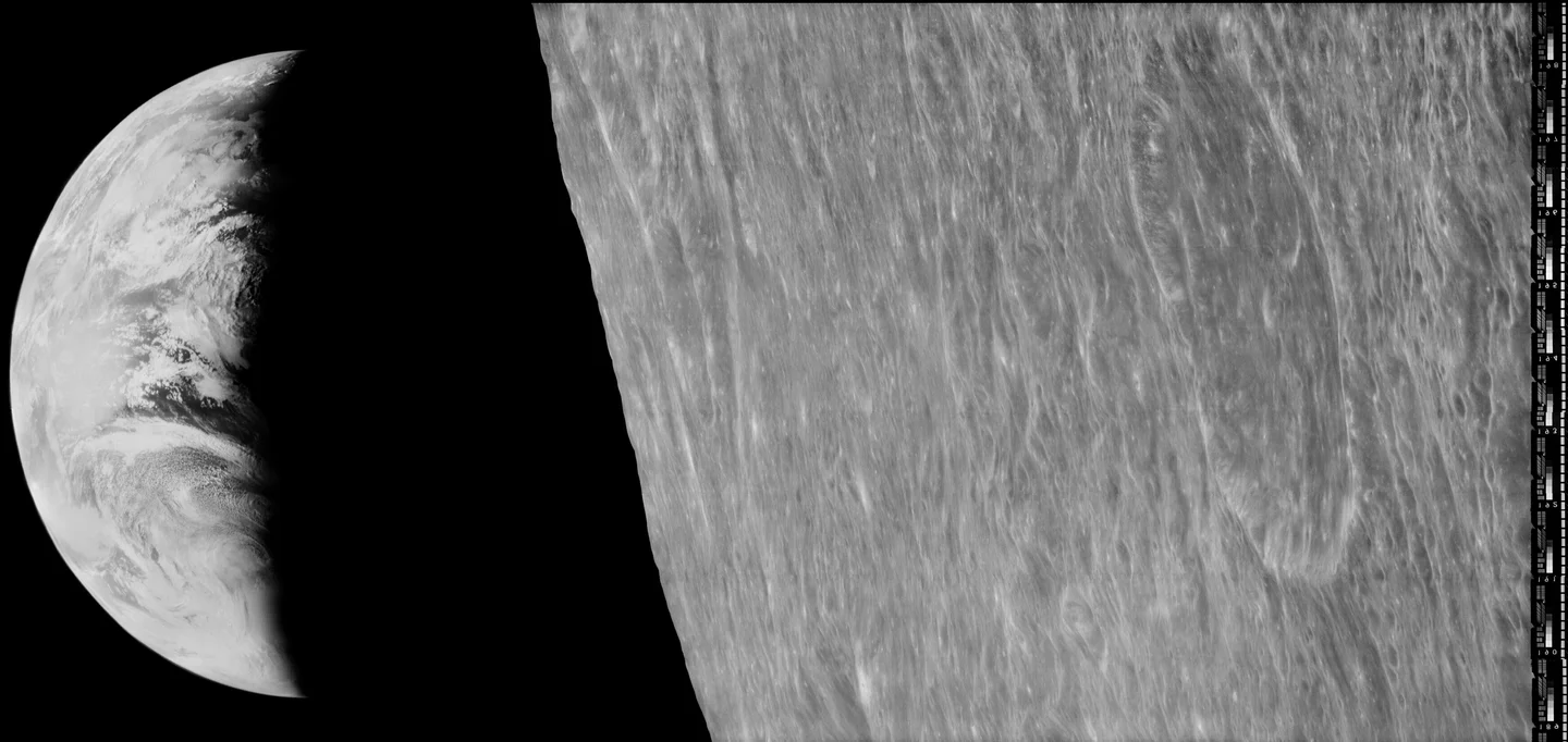 A narrow sunlit Earth appears at left beside the lunar landscape at right in a black-and-white Lunar Orbiter 1 image.