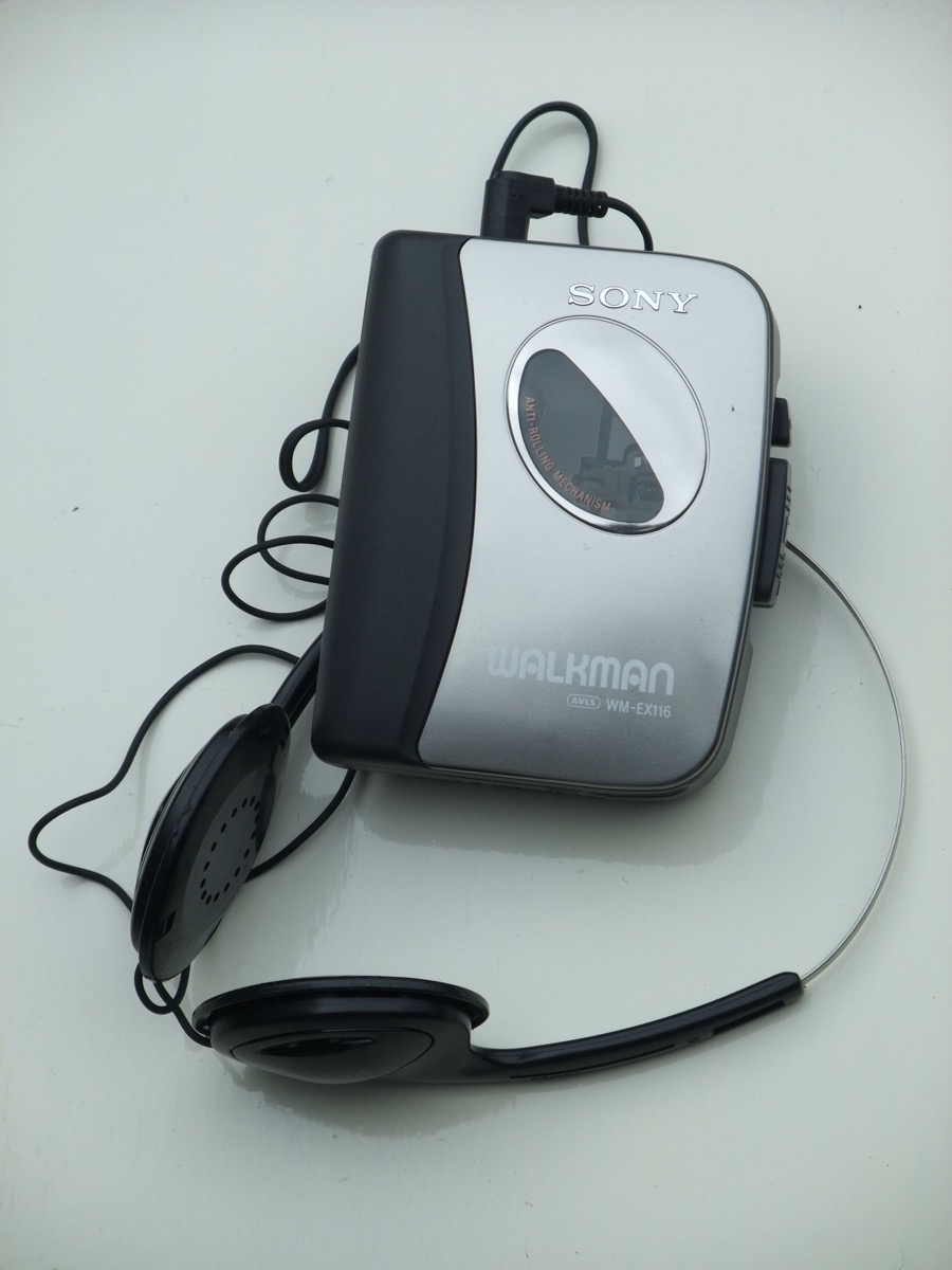 A Sony Walkman cassette player with headphones