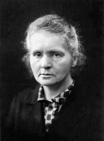 Black-and-white portrait of Marie Curie looking toward the camera.