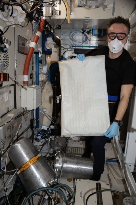 Astronaut Matthias Maurer replaces a bladder in the ISS Brine Processor Assembly.