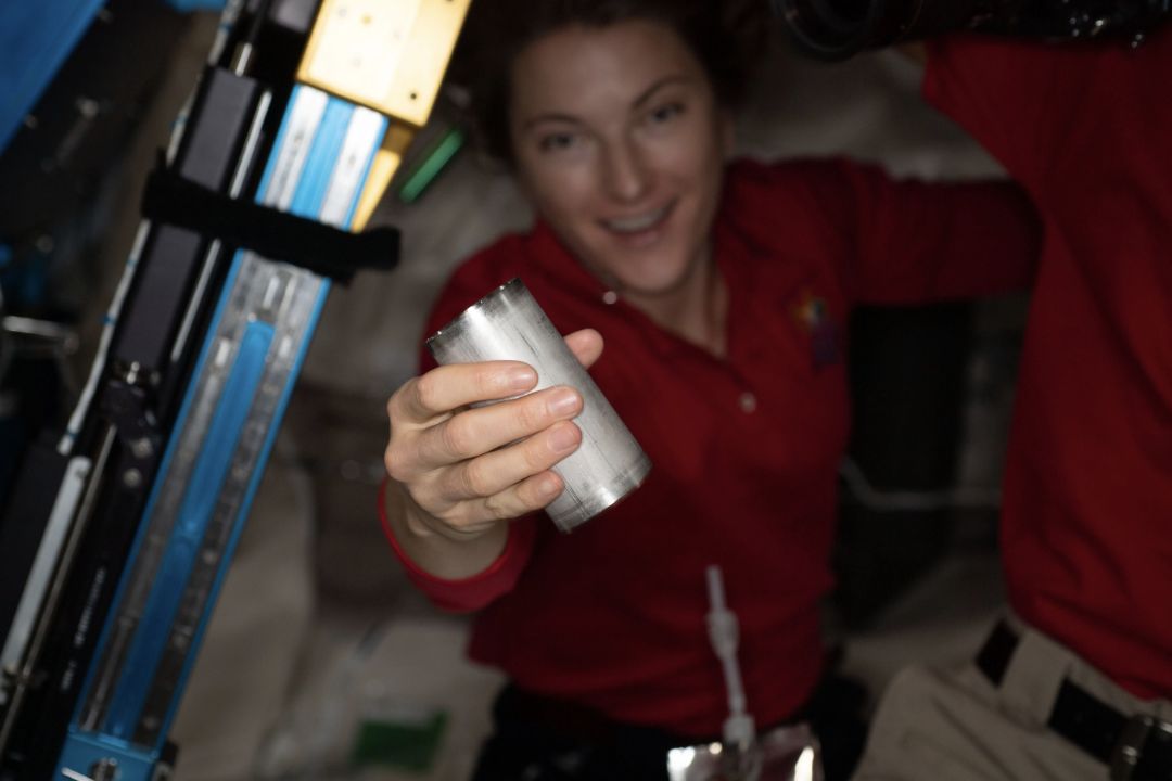Astronaut Kayla Barron replaces a filter in the ISS Brine Processor Assembly.