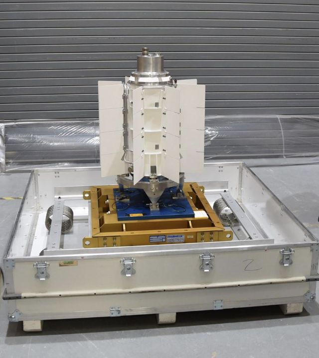 Finned cylindrical MMRTG unit on Earth before fueling and testing.