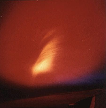 Red and orange glow of the Starfish Prime nuclear test above a dark horizon.